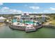 Aerial view of a large community pool surrounded by lounge chairs and cabanas at 19183 Coastal Shore Ter, Land O Lakes, FL 34638