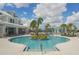 Spectacular pool with island and building access offers a luxurious community experience with swimming and socializing space at 19183 Coastal Shore Ter, Land O Lakes, FL 34638