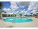 Stunning community pool with a central gazebo offers a luxurious space for swimming, socializing, and enjoying the outdoors at 19183 Coastal Shore Ter, Land O Lakes, FL 34638