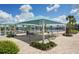 Community shade and recreation area offers comfortable seating and outdoor amenities, perfect for relaxation and social activities at 19183 Coastal Shore Ter, Land O Lakes, FL 34638