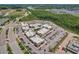 Aerial view of a meticulously designed shopping center with ample parking and diverse retail options at 19183 Coastal Shore Ter, Land O Lakes, FL 34638