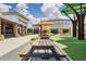 Pleasant shopping center with outdoor picnic tables, landscaped greenery and a variety of dining options at 19183 Coastal Shore Ter, Land O Lakes, FL 34638