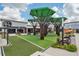 Modern outdoor retail setting with covered seating, inviting green spaces, and a variety of shops and restaurants at 19183 Coastal Shore Ter, Land O Lakes, FL 34638