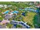 Aerial view of the community center, pool, tennis courts, and surrounding homes at 20106 Bending Creek Pl, Tampa, FL 33647