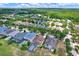 A high-angle aerial of a residential community with trees, lakes, and private homes at 20106 Bending Creek Pl, Tampa, FL 33647