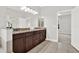 Large bathroom with double vanity, granite countertop, tile floor, and view to the bedroom at 20106 Bending Creek Pl, Tampa, FL 33647
