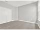 Bright bedroom featuring neutral walls, carpet, and closet with classic double doors at 20106 Bending Creek Pl, Tampa, FL 33647
