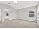 Bright bedroom featuring neutral walls, carpet, and a window with natural light at 20106 Bending Creek Pl, Tampa, FL 33647