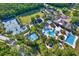 Aerial view of community amenities, including a pool, tennis courts, and playground at 20106 Bending Creek Pl, Tampa, FL 33647
