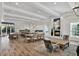 Spacious clubhouse featuring an open floor plan with kitchen, dining area, fireplace, and modern decor at 20106 Bending Creek Pl, Tampa, FL 33647