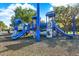 Bright and colorful community playground equipped with slides, climbing structures, and soft ground cover at 20106 Bending Creek Pl, Tampa, FL 33647
