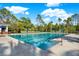 Large, inviting community pool with lounge chairs and umbrellas, perfect for sunny days and relaxation at 20106 Bending Creek Pl, Tampa, FL 33647