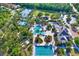 An aerial view of a community pool, tennis courts, clubhouse, and lush landscaping at 20106 Bending Creek Pl, Tampa, FL 33647