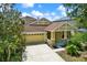 Two-story home with a two-car garage, inviting front porch, and well-maintained landscaping at 20106 Bending Creek Pl, Tampa, FL 33647
