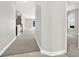 Hallway with carpet and stairs and a view of the house beyond at 20106 Bending Creek Pl, Tampa, FL 33647