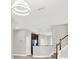 Open floor plan with stairway leading to the kitchen featuring an eat-in bar at 20106 Bending Creek Pl, Tampa, FL 33647