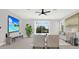 Living room features a tv and ceiling fan providing a stylish spot for relaxation and entertainment at 20106 Bending Creek Pl, Tampa, FL 33647