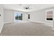 Spacious living room with carpeted floors, recessed lights and sliding glass doors leading to the outdoor patio at 20106 Bending Creek Pl, Tampa, FL 33647