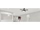 Open-concept living room with recessed lighting, chandelier and view to kitchen and stairway at 20106 Bending Creek Pl, Tampa, FL 33647