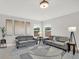 Living room with recessed lighting, two sofas, neutral paint, and an area rug at 20106 Bending Creek Pl, Tampa, FL 33647