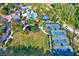 An aerial view of the tennis courts and pool in a well-maintained community at 20106 Bending Creek Pl, Tampa, FL 33647