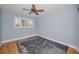 Bedroom with a window and wood flooring has lots of natural light at 2073 Denmark St # 9, Clearwater, FL 33763