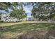 Expansive grassy area between buildings with mature trees providing ample shade at 2073 Denmark St # 9, Clearwater, FL 33763