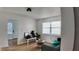 Bright living room featuring a green sofa with a small table, and wood flooring at 2219 Thrace St, Tampa, FL 33605