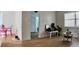 Open living area with laminate flooring, comfortable furniture, and natural light at 2219 Thrace St, Tampa, FL 33605