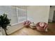Cozy living room features comfortable seating, a modern table, and natural light from a large window at 2219 Thrace St, Tampa, FL 33605