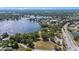 This aerial shot reveals a lakeside community with a playground, basketball court, and lush landscaping at 22852 Fern Ct, Land O Lakes, FL 34639