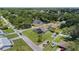 An aerial view of a neighborhood with tree-lined streets and well-maintained lawns at 22852 Fern Ct, Land O Lakes, FL 34639