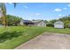 A well-maintained backyard showcasing lush green grass and the home's back porch at 22852 Fern Ct, Land O Lakes, FL 34639