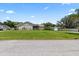 Backyard with a lush lawn and storage shed at 22852 Fern Ct, Land O Lakes, FL 34639