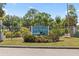 Welcoming entrance sign to the waterfront and equestrian community of Lake Padgett Estates at 22852 Fern Ct, Land O Lakes, FL 34639