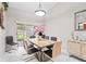 Contemporary dining room with a wooden table, modern chairs, and elegant decor at 22852 Fern Ct, Land O Lakes, FL 34639