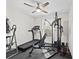 Exercise room with ceiling fan, large window, and workout equipment at 22852 Fern Ct, Land O Lakes, FL 34639