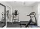 Exercise room with mirrored closet, ceiling fan, and workout equipment at 22852 Fern Ct, Land O Lakes, FL 34639