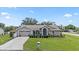 Inviting single-story home boasting a well-kept lawn, mature trees, and a two-car garage at 22852 Fern Ct, Land O Lakes, FL 34639