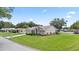 Charming single-story home with well-manicured lawn, landscaping, and neutral exterior at 22852 Fern Ct, Land O Lakes, FL 34639