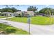 Charming front exterior with a manicured lawn and landscaping at 22852 Fern Ct, Land O Lakes, FL 34639