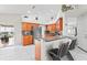 Modern kitchen with stainless steel appliances, bar seating, and access to outdoor space at 22852 Fern Ct, Land O Lakes, FL 34639