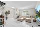 Spacious living area featuring modern decor, tile floors, and abundant natural light at 22852 Fern Ct, Land O Lakes, FL 34639