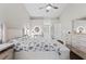 Inviting main bedroom features neutral decor, wood floors, and a vanity area at 22852 Fern Ct, Land O Lakes, FL 34639