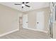 Bedroom featuring modern lighting, modern ceiling fan, and modern doors at 2303 E Osborne Ave, Tampa, FL 33610