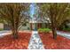 Charming home with a well-manicured front yard and inviting entryway at 2303 E Osborne Ave, Tampa, FL 33610