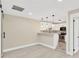 Bright kitchenette with updated appliances, sleek countertops, and modern lighting at 2303 E Osborne Ave, Tampa, FL 33610