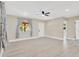 Cozy living space with natural light, a ceiling fan, and pristine new flooring at 2303 E Osborne Ave, Tampa, FL 33610