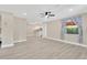 Open-concept living area showcasing modern finishes and seamless flow to the kitchen at 2303 E Osborne Ave, Tampa, FL 33610