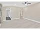 Spacious main bedroom featuring modern ceiling fan, and modern flooring at 2303 E Osborne Ave, Tampa, FL 33610